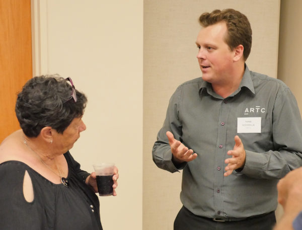 Project director Max Nichols with community members
