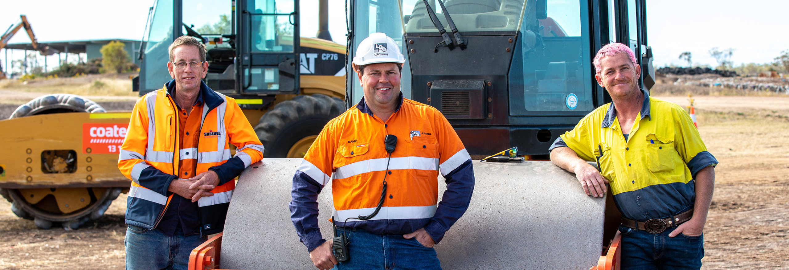 Workshop participants Jason Pearce (L) and Adrian Davison (R) with trainer Damian Blinman (C) posing for a photograph during the Constructions skills training workshop, Moree, New South Wales. Images taken at a training session held at the Moree Waste Facility Site run by Moree Plains Shire Council.