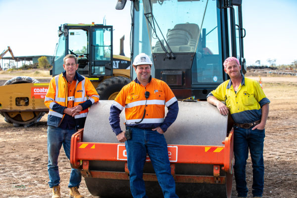Workshop participants Jason Pearce (L) and Adrian Davison (R) with trainer Damian Blinman (C) posing for a photograph during the Constructions skills training workshop, Moree, New South Wales. Images taken at a training session held at the Moree Waste Facility Site run by Moree Plains Shire Council.