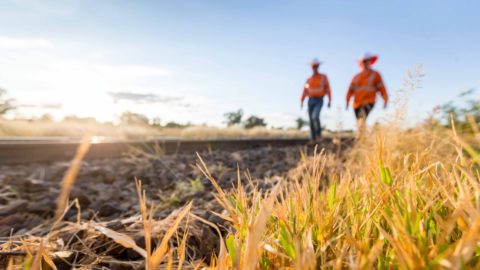 Workers are seen at the construction site of the Inland Rail between Parkes and Narromine, New South Wales.