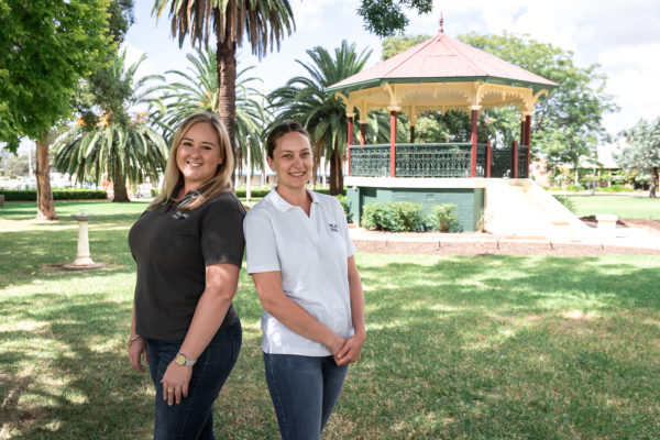 Two Inland Rail employees standing in front of a gazebo