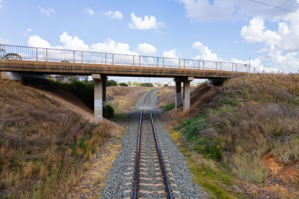 A road bridge travelling over a rail line.
