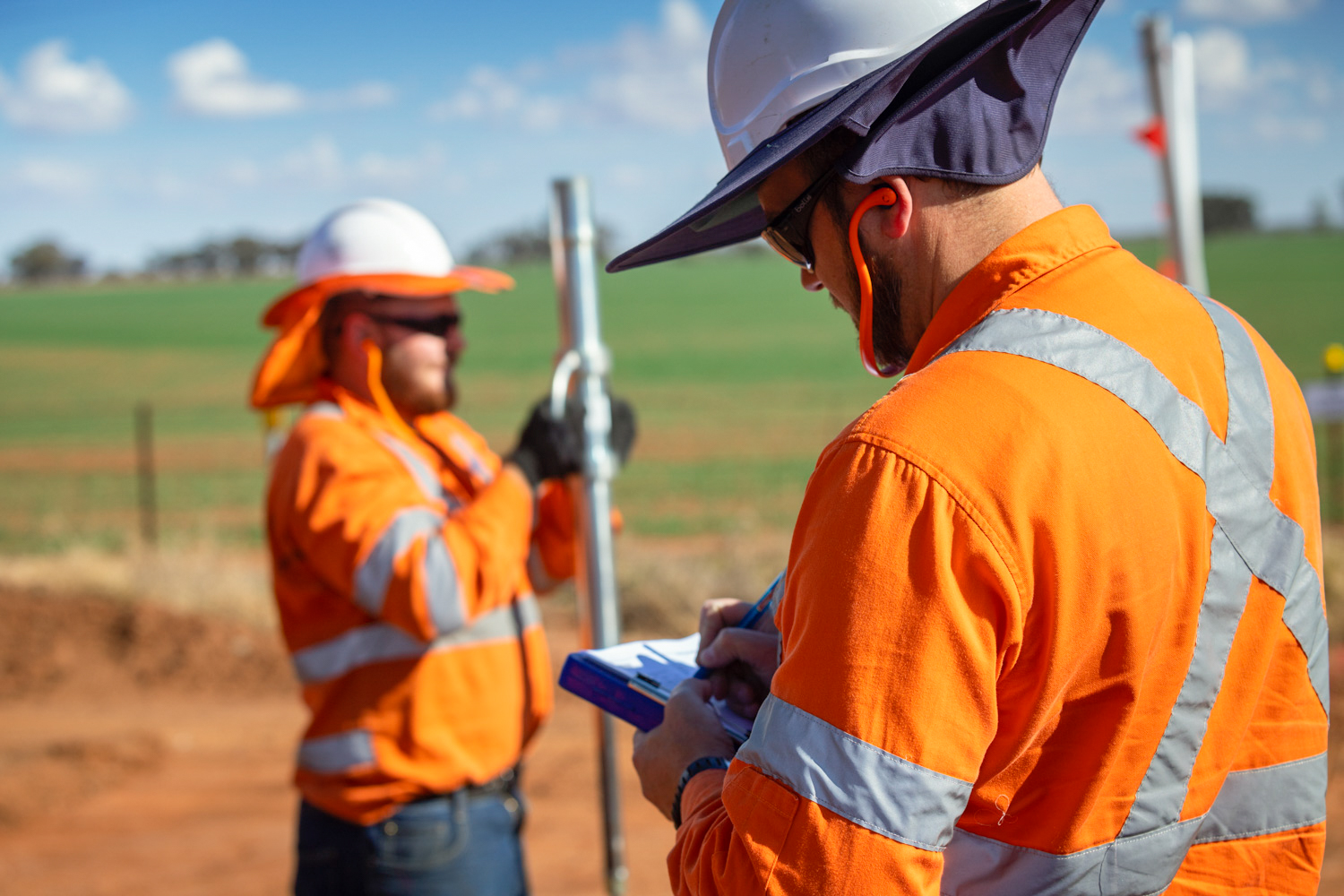 Two rail workers performing investigations