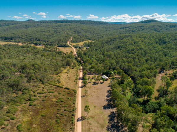 Aerial view of new line, Gittins Road at Six Mile Creek Road, Postmans Ridge, Queensland.
