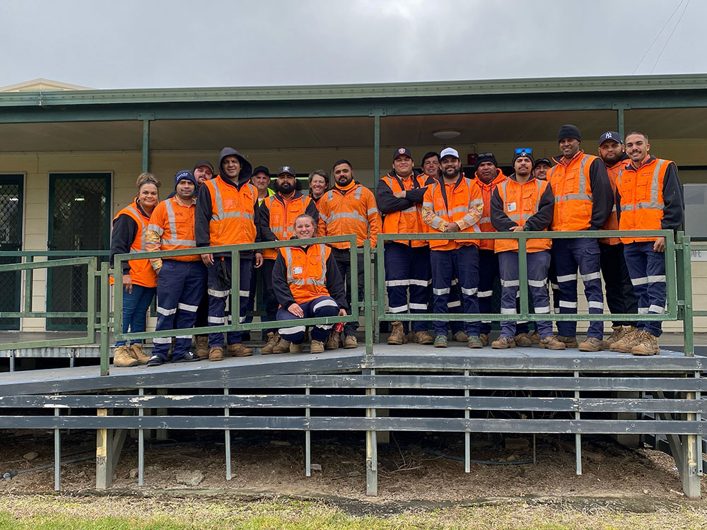 Smiling Trans4m Rail TAFE students on the day of their graduation.