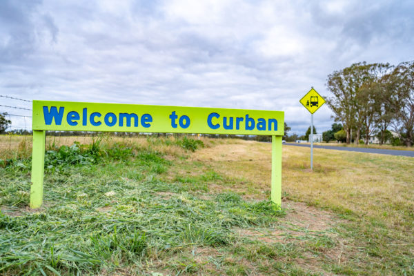 Welcome to Curban roadside sign