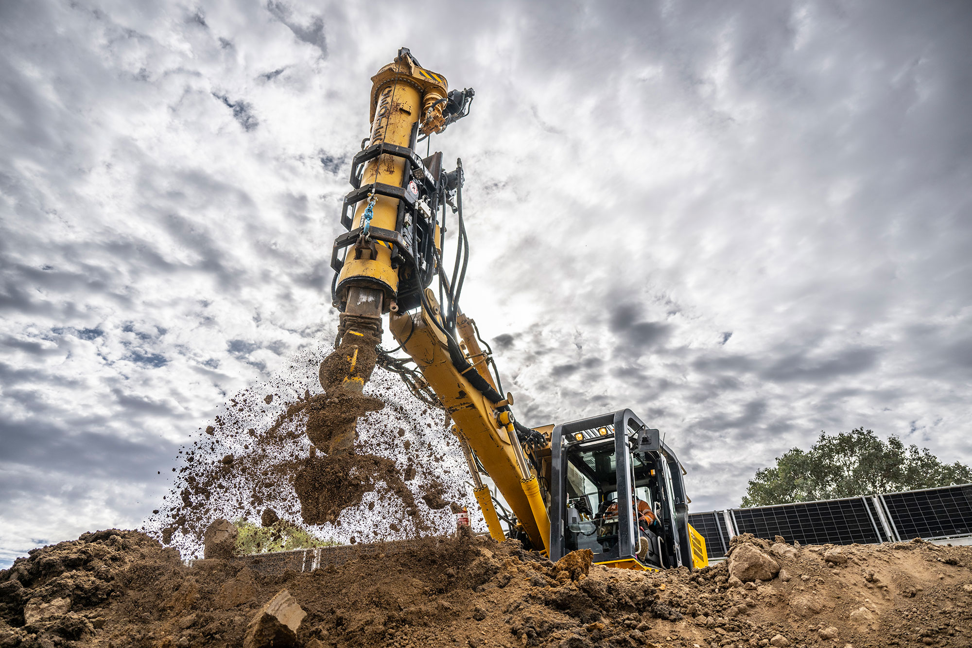 Image of a piling drill shaking off dirt after drilling holes at Glenrowan
