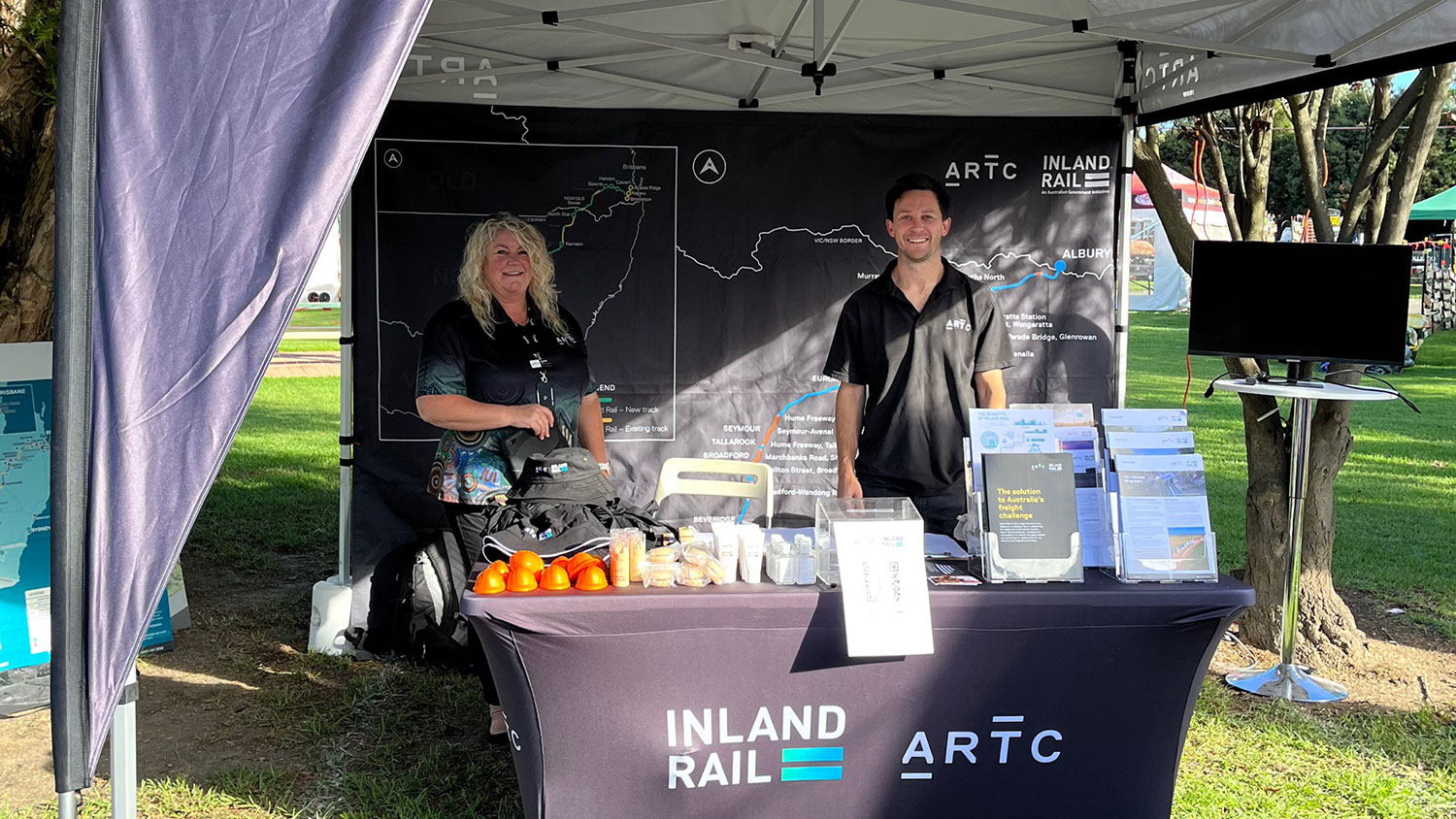 Image of Inland Rail staff, Jacinta Piazza and Hamish Pink, at the Inland Rail stand for the Seymour Expo.
