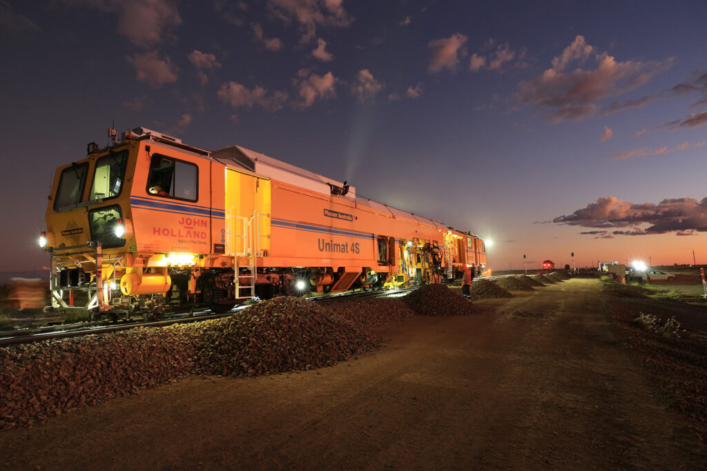 Image of tamping train at night on Tycannah crossing loop section of work