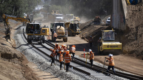 A construction site showing workers constructing and rehabilitating a rail line in Victoria.