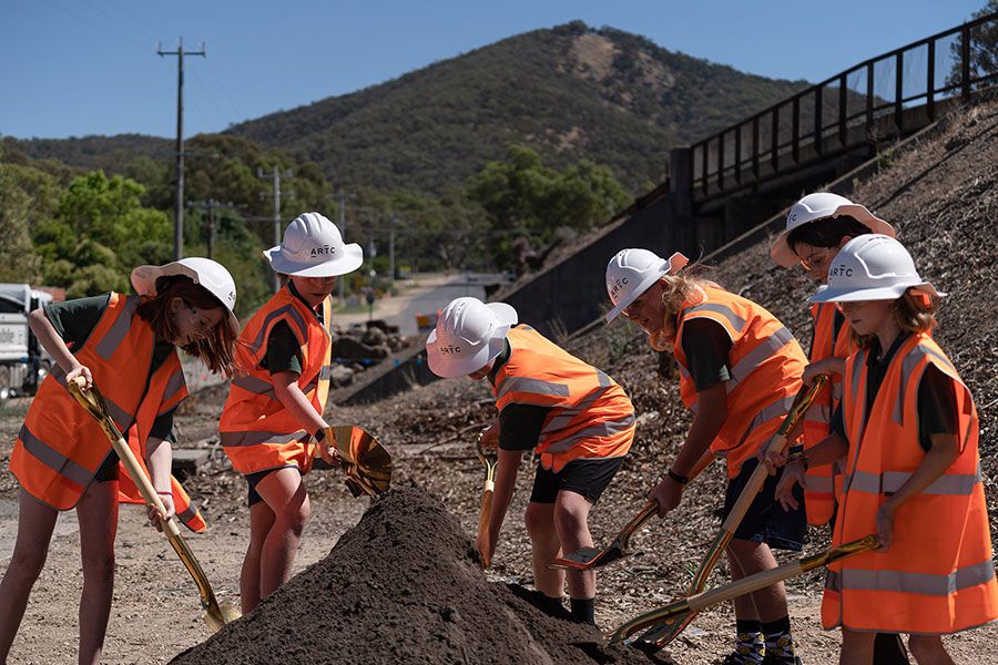Children participate in sod turning ceremony.