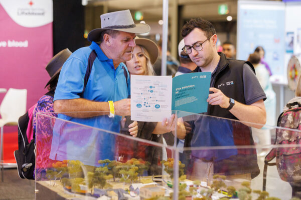 Two people talking about Inland Rail at the Royal Easter Show