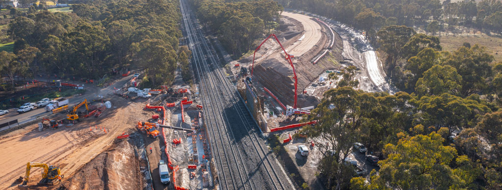 A rail construction site in a rural setting.