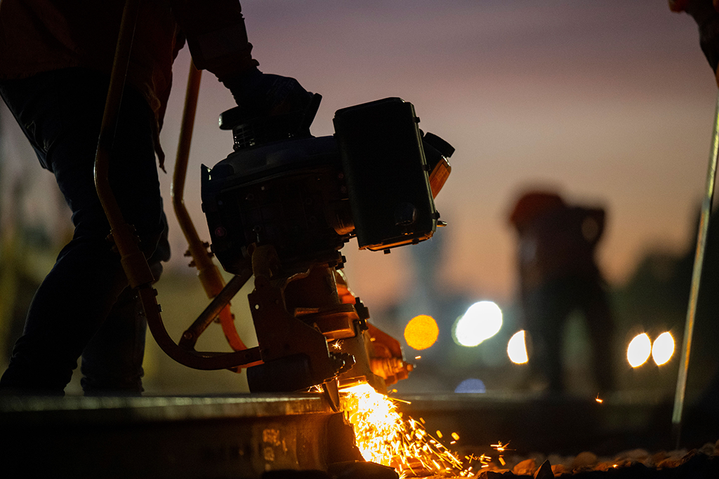 Working on the railway track at dusk