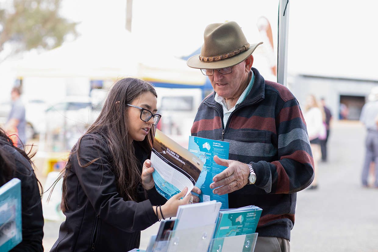 Two people talking to each other at the Junee Show