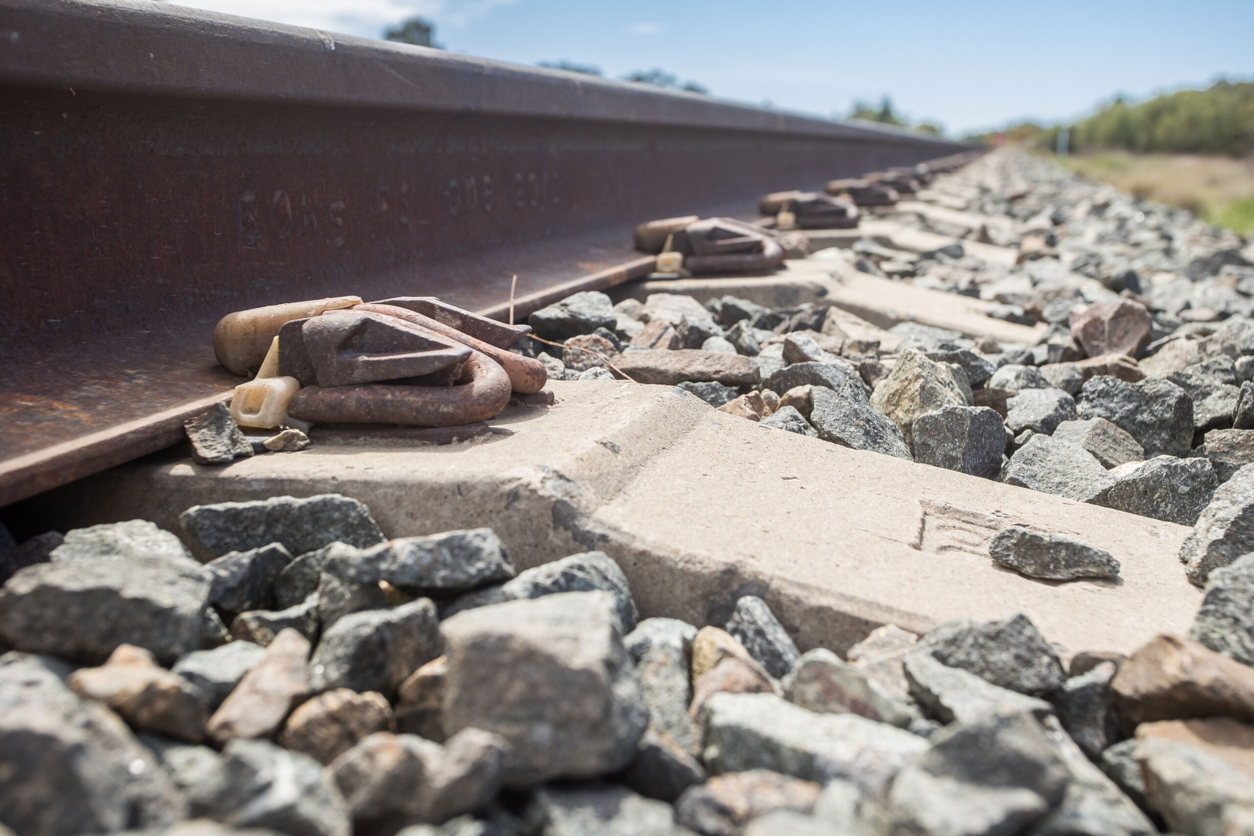 Rail line, with a rail clip and ballast