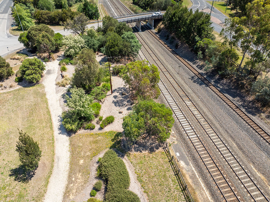 A view of a bridge mover multiple railway tracks, as seen from the air.