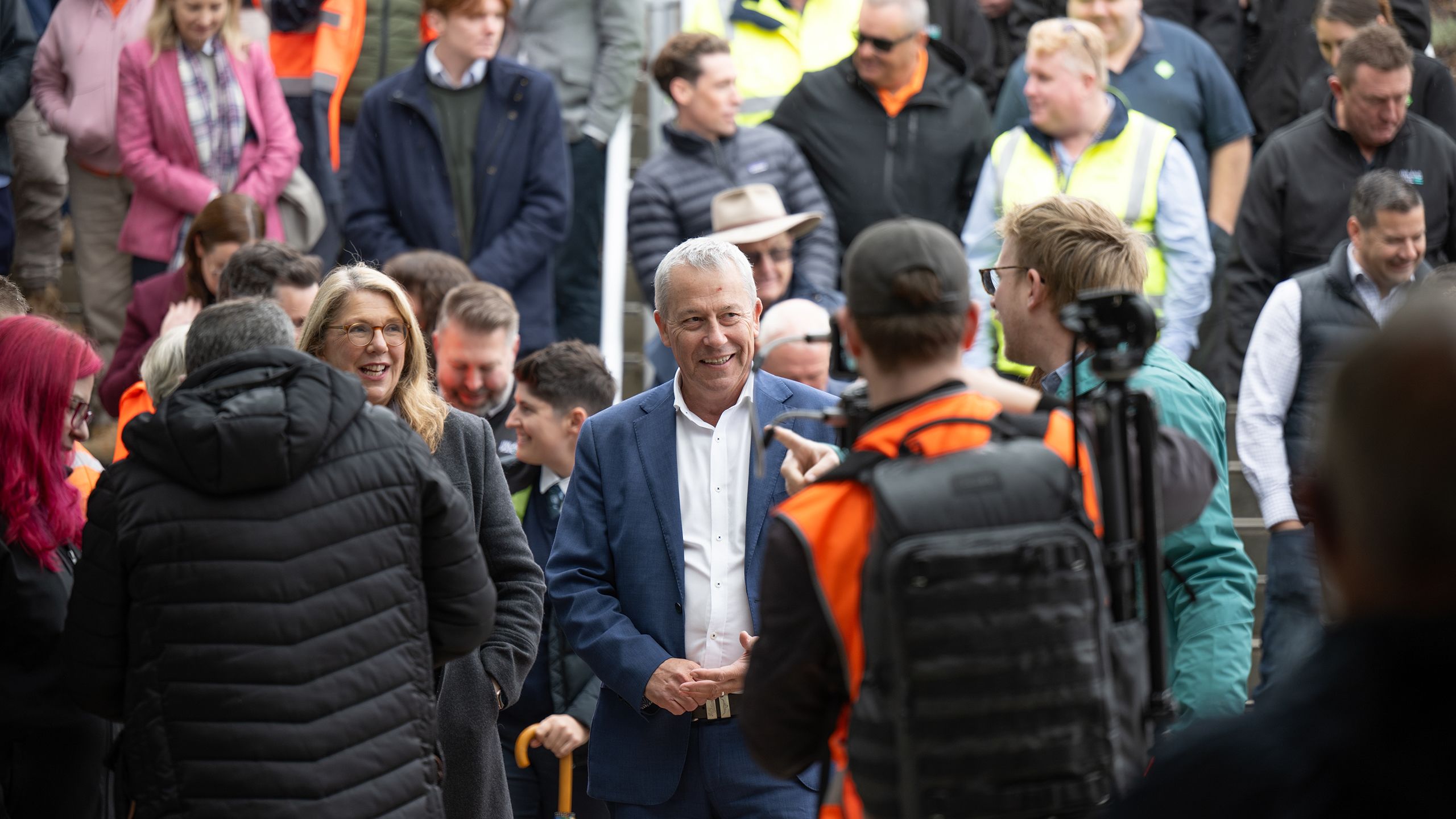 Crowd of people talking and smiling