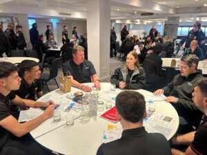 Students hear about employment pathways with Martinus and Inland Rail representatives sitting around a table inside