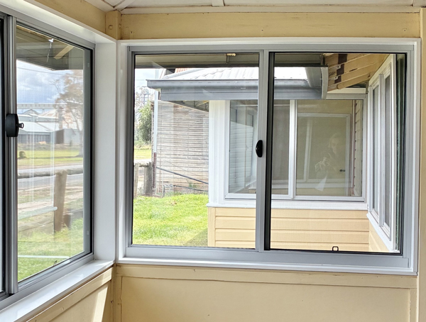 A window with views to a rural setting.