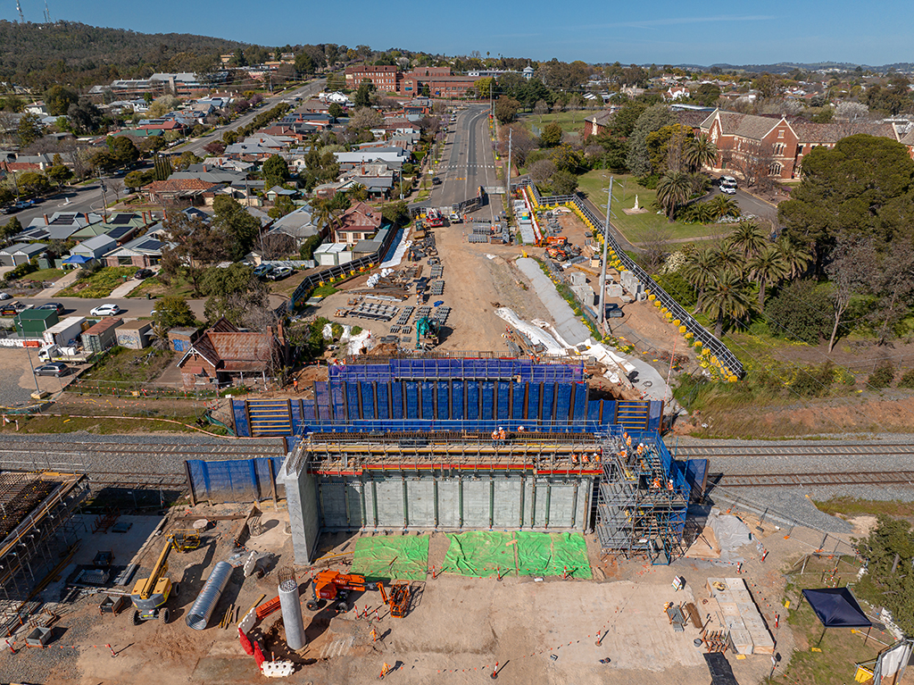 Aerial view of Edmondson Street bridge construction above railway tracks with surrounding roadworks.